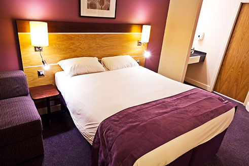 An image of a hotel bedroom, part of a commercial project for Premier Inn, Gateshead.