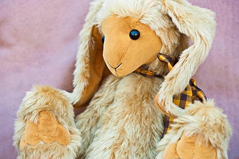 A fluffy, hand-crafted rabbit made by Emily Pitkethly - product photography by David Taylor. 