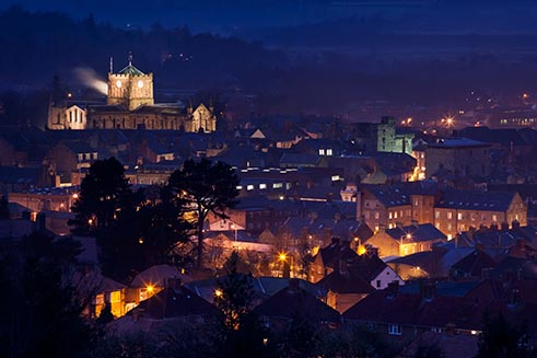 A view of Hexham Abbey at night, floodlit, which featured in the book ‘Northumberland Illuminated’.