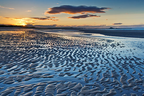 A beautiful image of ripples in the sand, at Ross Sands, Northumberland, at sunset. 