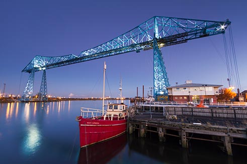An atmospheric photograph of the Transporter Bridge, Middlesbrough, at dusk, by photographer David Taylor. 