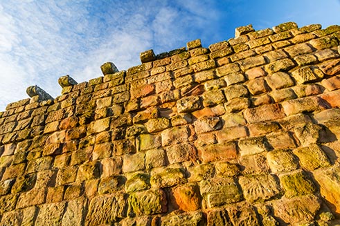 A colourful image of a wall of Etal Castle, Northumberland, for North East Life Magazine. 